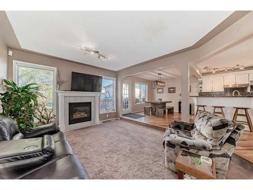 15510 Mckenzie Lake Way Se, Calgary, AB - Indoor Photo Showing Living Room With Fireplace