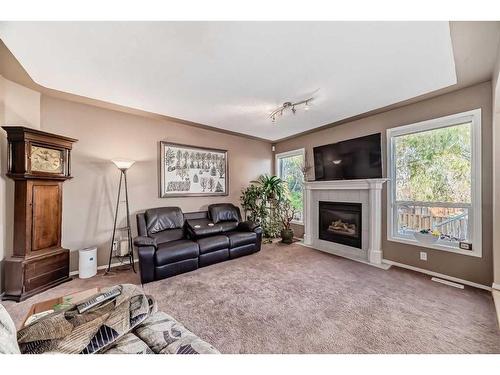 15510 Mckenzie Lake Way Se, Calgary, AB - Indoor Photo Showing Living Room With Fireplace