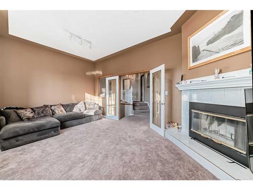 15510 Mckenzie Lake Way Se, Calgary, AB - Indoor Photo Showing Living Room With Fireplace