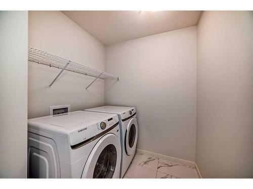 274 Aquila Drive Nw, Calgary, AB - Indoor Photo Showing Laundry Room