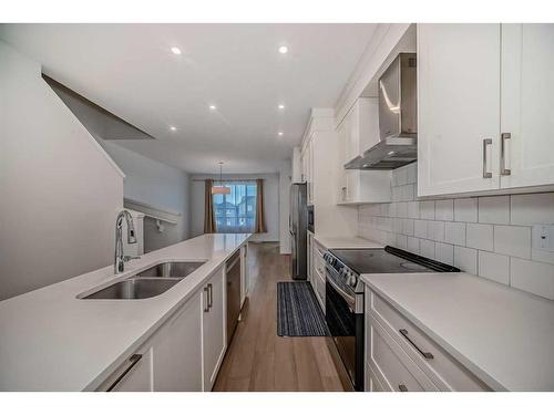 274 Aquila Drive Nw, Calgary, AB - Indoor Photo Showing Kitchen With Double Sink