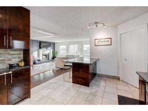 43 Berkshire Road Nw, Calgary, AB - Indoor Photo Showing Other Room With Fireplace