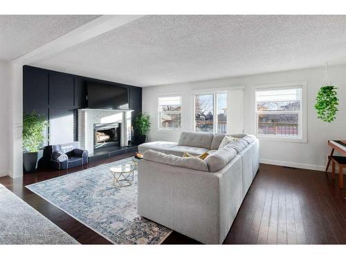 43 Berkshire Road Nw, Calgary, AB - Indoor Photo Showing Living Room With Fireplace