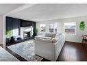 43 Berkshire Road Nw, Calgary, AB  - Indoor Photo Showing Living Room With Fireplace 