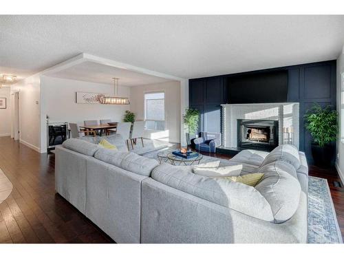 43 Berkshire Road Nw, Calgary, AB - Indoor Photo Showing Living Room With Fireplace