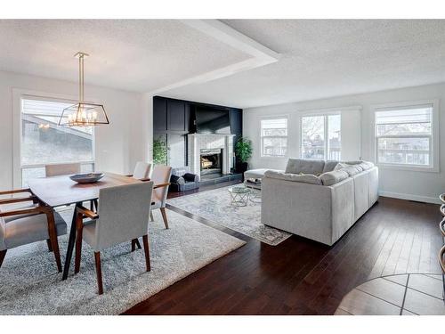 43 Berkshire Road Nw, Calgary, AB - Indoor Photo Showing Living Room With Fireplace