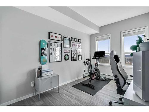 402-4150 Seton Drive Se, Calgary, AB - Indoor Photo Showing Gym Room