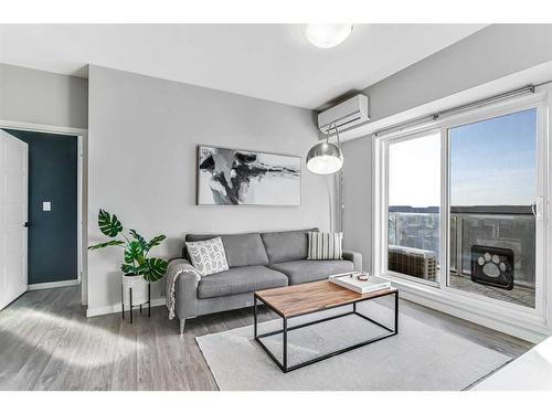 402-4150 Seton Drive Se, Calgary, AB - Indoor Photo Showing Living Room