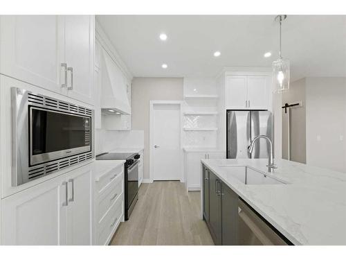 329 Copperhead Way Se, Calgary, AB - Indoor Photo Showing Kitchen With Upgraded Kitchen