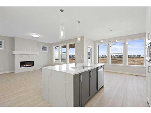 329 Copperhead Way Se, Calgary, AB - Indoor Photo Showing Kitchen With Fireplace With Upgraded Kitchen