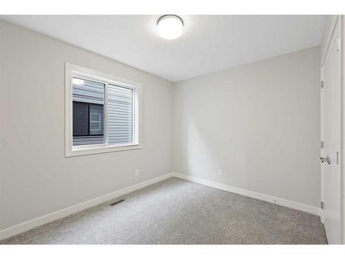 329 Copperhead Way Se, Calgary, AB - Indoor Photo Showing Other Room