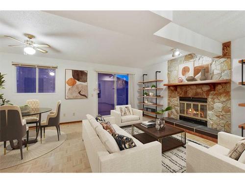 356 Whitworth Way Ne, Calgary, AB - Indoor Photo Showing Living Room With Fireplace