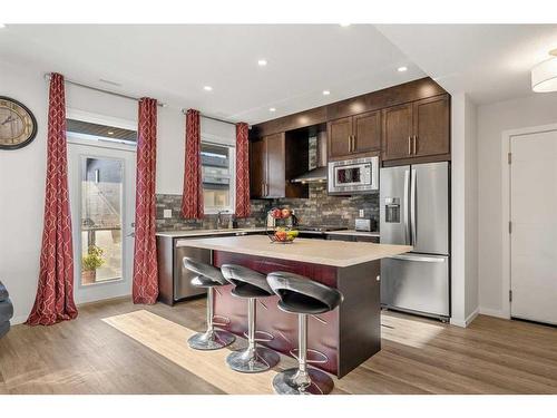 204-140 Redstone Walk Ne, Calgary, AB - Indoor Photo Showing Kitchen With Stainless Steel Kitchen With Upgraded Kitchen