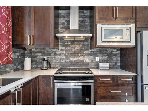 204-140 Redstone Walk Ne, Calgary, AB - Indoor Photo Showing Kitchen With Stainless Steel Kitchen With Upgraded Kitchen