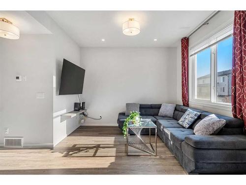 204-140 Redstone Walk Ne, Calgary, AB - Indoor Photo Showing Living Room