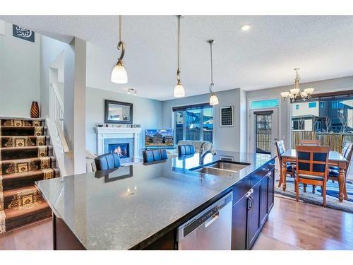 229 Sage Valley Road Nw, Calgary, AB - Indoor Photo Showing Kitchen With Fireplace With Double Sink With Upgraded Kitchen