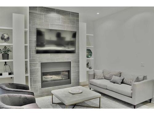 623 27 Avenue Ne, Calgary, AB - Indoor Photo Showing Living Room With Fireplace