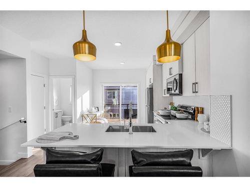 3 Cornerstone Row Ne, Calgary, AB - Indoor Photo Showing Kitchen With Double Sink With Upgraded Kitchen