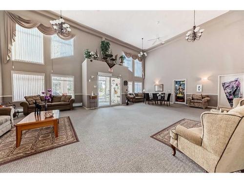 109-550 Prominence Rise Sw, Calgary, AB - Indoor Photo Showing Living Room