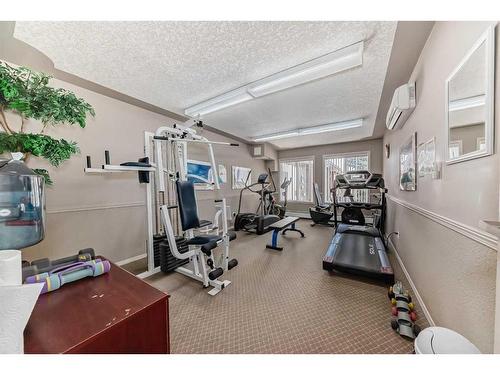 109-550 Prominence Rise Sw, Calgary, AB - Indoor Photo Showing Gym Room