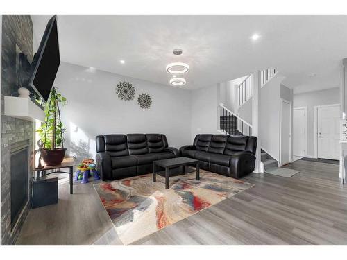 169 Corner Meadows Way Ne, Calgary, AB - Indoor Photo Showing Living Room With Fireplace