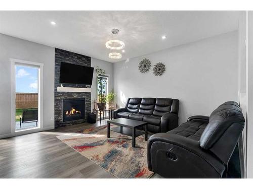 169 Corner Meadows Way Ne, Calgary, AB - Indoor Photo Showing Living Room With Fireplace