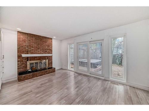 127 Sunmills Place Se, Calgary, AB - Indoor Photo Showing Living Room With Fireplace