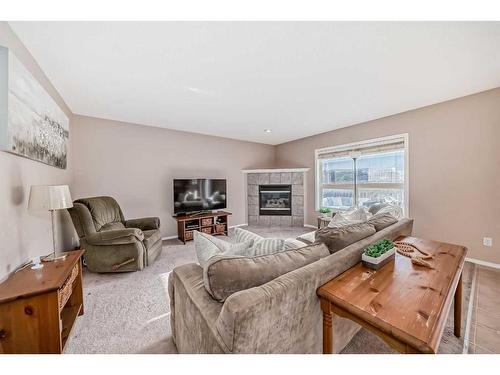 70 Chapala Grove Se, Calgary, AB - Indoor Photo Showing Living Room With Fireplace