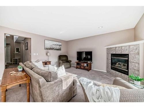 70 Chapala Grove Se, Calgary, AB - Indoor Photo Showing Living Room With Fireplace