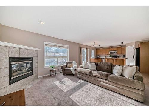 70 Chapala Grove Se, Calgary, AB - Indoor Photo Showing Living Room With Fireplace