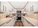 312-9930 Bonaventure Drive Se, Calgary, AB  - Indoor Photo Showing Kitchen With Stainless Steel Kitchen With Double Sink 