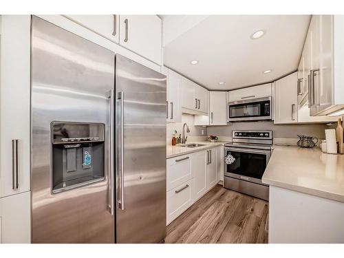 312-9930 Bonaventure Drive Se, Calgary, AB - Indoor Photo Showing Kitchen With Stainless Steel Kitchen