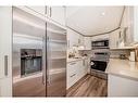 312-9930 Bonaventure Drive Se, Calgary, AB  - Indoor Photo Showing Kitchen With Stainless Steel Kitchen 