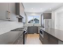 83 Sugarsnap Avenue Se, Calgary, AB  - Indoor Photo Showing Kitchen With Stainless Steel Kitchen With Upgraded Kitchen 