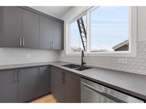 83 Sugarsnap Avenue Se, Calgary, AB - Indoor Photo Showing Kitchen With Double Sink