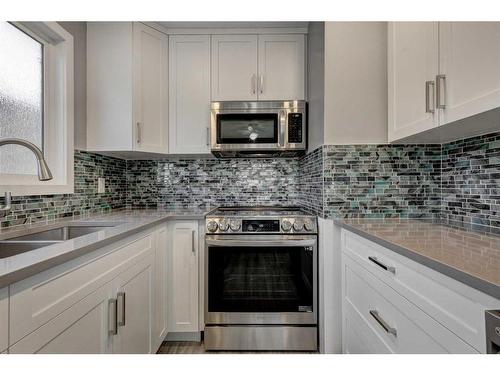 238 Woodmont Court Sw, Calgary, AB - Indoor Photo Showing Kitchen With Double Sink With Upgraded Kitchen