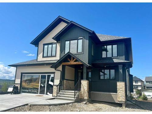 2 Heritage Close, Cochrane, AB - Outdoor With Facade