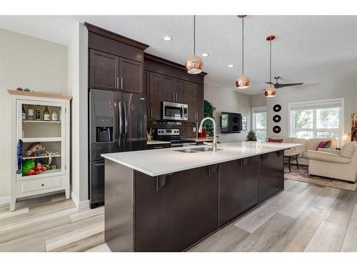 295 Silverado Plains Park Sw, Calgary, AB - Indoor Photo Showing Kitchen With Upgraded Kitchen