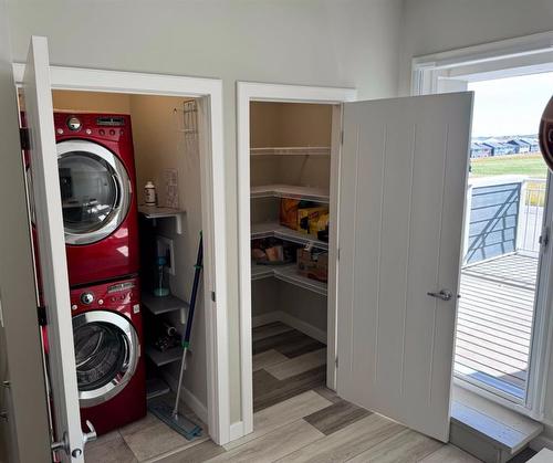 295 Silverado Plains Park Sw, Calgary, AB - Indoor Photo Showing Laundry Room