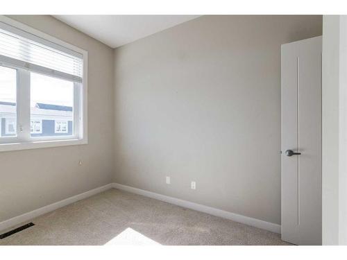 295 Silverado Plains Park Sw, Calgary, AB - Indoor Photo Showing Other Room