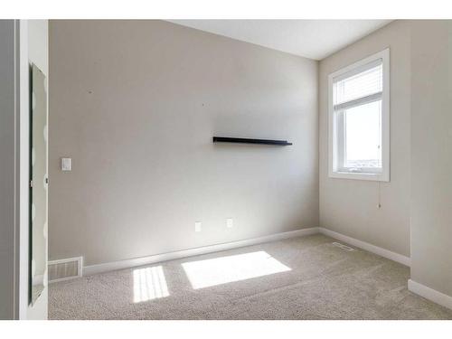 295 Silverado Plains Park Sw, Calgary, AB - Indoor Photo Showing Other Room