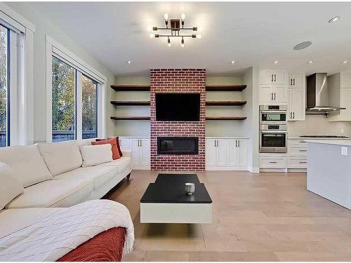 2322 24 Avenue Sw, Calgary, AB - Indoor Photo Showing Living Room With Fireplace