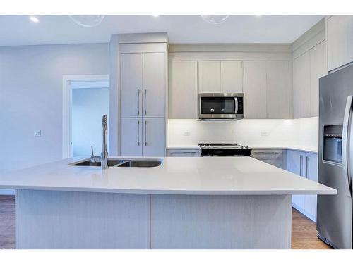 1306-395 Skyview Parkway Ne, Calgary, AB - Indoor Photo Showing Kitchen With Double Sink With Upgraded Kitchen