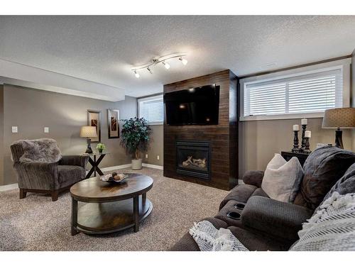 627 2 Avenue South, Vulcan, AB - Indoor Photo Showing Living Room With Fireplace