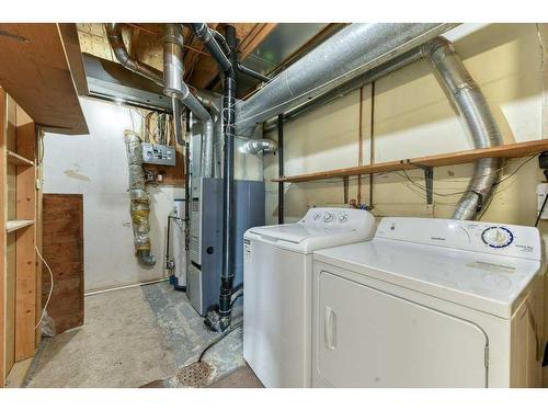 138 Oaktree Lane Sw, Calgary, AB - Indoor Photo Showing Laundry Room