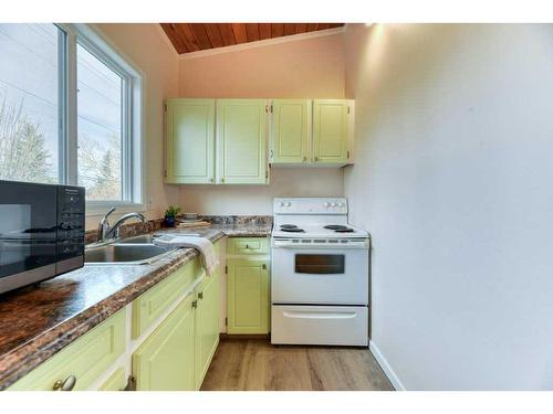 138 Oaktree Lane Sw, Calgary, AB - Indoor Photo Showing Kitchen With Double Sink