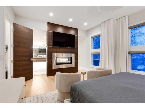 708 Madison Avenue Sw, Calgary, AB - Indoor Photo Showing Bedroom With Fireplace