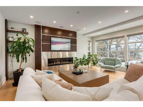 708 Madison Avenue Sw, Calgary, AB - Indoor Photo Showing Living Room With Fireplace