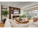 708 Madison Avenue Sw, Calgary, AB  - Indoor Photo Showing Living Room With Fireplace 