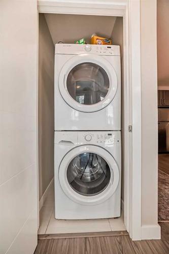 210-8 Sange  Hill Terrace Nw, Calgary, AB - Indoor Photo Showing Laundry Room